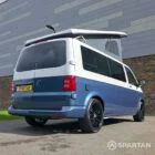 Spartan Campers VWT6 long wheel base campervan in bamboo and candy white. rear drivers quarter with roof up