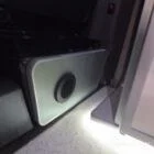 Spartan campers VW campervan with winter flooring, Italian Reed Green and Latte kitchen with Cookie upholstery. Fitted with a microwave, fridge/freezer, sink, wireless fast charger, rock and roll bed, and swivel and slide passenger bench seat