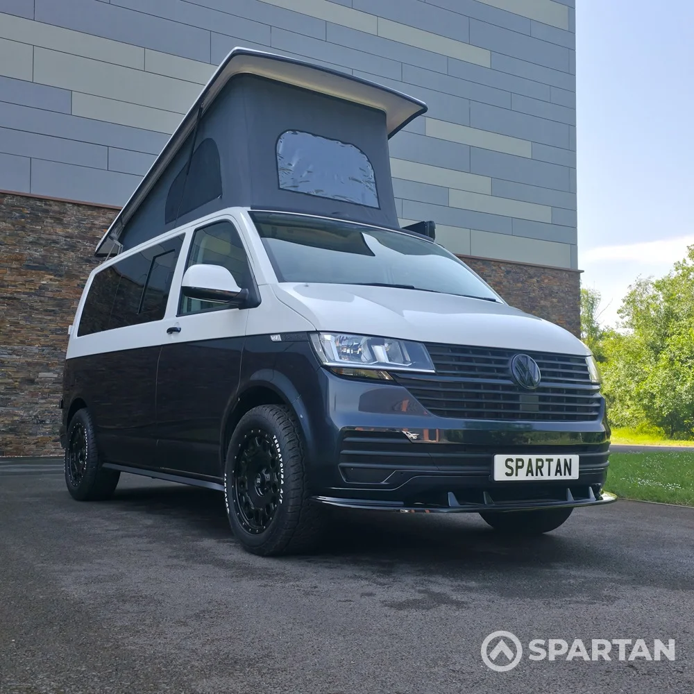 VW T6.1 campervan with full Spartan conversion. In starlight blue and candy white. Fitted with swamper wheels and a Fiamma F45 wind out awning