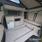 VW T7 SWB with full Spartan Campers conversion. winter flooring, latte and italian reed green kitchen, real wood worktop and cookie upholstery