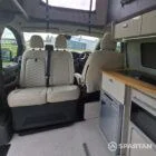 VW T7 SWB with full Spartan Campers conversion. winter flooring, latte and italian reed green kitchen, real wood worktop and cookie upholstery
