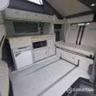 VW T7 SWB with full Spartan Campers conversion. winter flooring, latte and italian reed green kitchen, real wood worktop and cookie upholstery