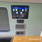 VW T7 SWB with full Spartan Campers conversion. winter flooring, latte and italian reed green kitchen, real wood worktop and cookie upholstery
