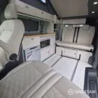VW T7 SWB with full Spartan Campers conversion. winter flooring, latte and italian reed green kitchen, real wood worktop and cookie upholstery