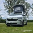 VW T7 SWB in Meadow Green front passenger quarter, pop top up