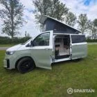 VW T7 in Meadow Green, passengers side, pop top up, doors open