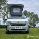 VW T7 SWB in Meadow Green front, pop top up