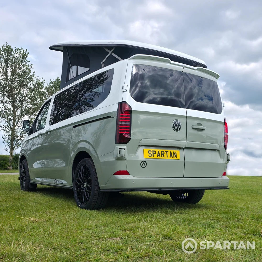 VW T7 SWB in Meadow Green rear passenger quarter, pop top up