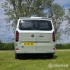 VW T7 in Meadow Green, rear, pop top down