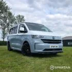 VW T7 SWB Spartan campers campervan in squirrel grey, drivers front quarter with pop top down