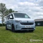 VW T7 SWB Spartan campers campervan in squirrel grey, drivers front quarter with pop top down