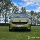 VW T7 SWB Spartan Campers campervan in warm metallic green, front with pop top roof down