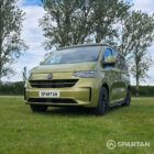 VW T7 SWB Spartan Campers campervan in warm metallic green, passengers front quarter with pop top roof down