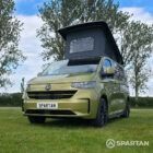 VW T7 SWB Spartan Campers campervan in warm metallic green, passengers front quarter with pop top roof up