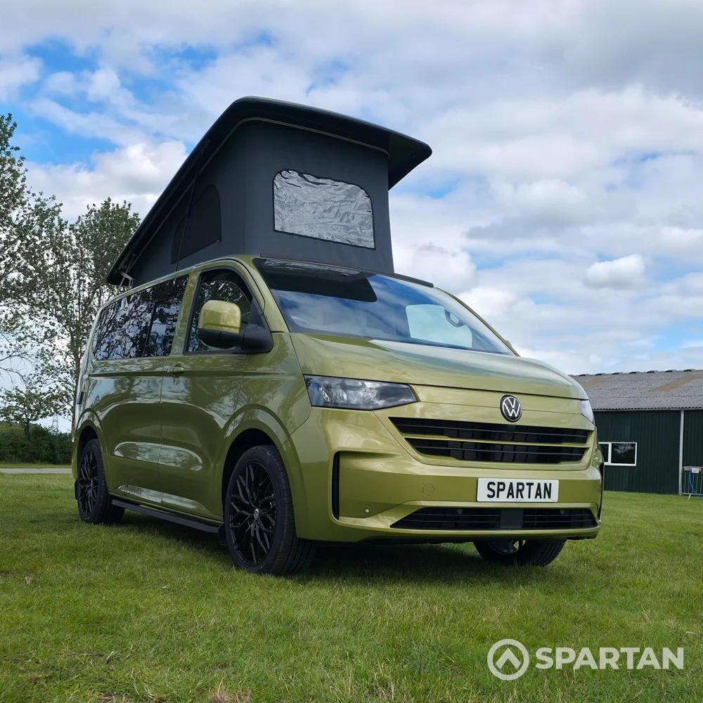 VW T7 SWB Spartan Campers campervan in warm metallic green, drivers front quarter with pop top roof up