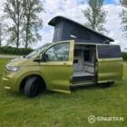 VW T7 SWB Spartan Campers campervan in warm metallic green, passengers side with pop top roof up and doors open