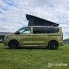 VW T7 SWB Spartan Campers campervan in warm metallic green, passenger side with pop top roof up