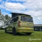 VW T7 SWB Spartan Campers campervan in warm metallic green, passengers rear quarter with pop top roof up