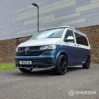 Front passenger side three-quarter view of the Spartan VW T6.1 SWB campervan parked outdoors.