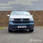 Front view of the Bamboo Green and Candy White Spartan VW T6.1 SWB campervan showcasing the distinctive two-tone paintwork, LED headlights and Volkswagen grille.