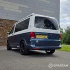 Rear passenger side three-quarter angle of the Spartan VW T6.1 SWB campervan with privacy glass and elevating roof.