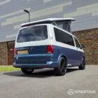 Rear driver's side three-quarter view showing the tailgate, alloy wheels and colour-coded rear styling.