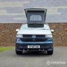 Front view with the pop-top roof raised on the Bamboo Green and Candy White Spartan VW T6.1 SWB campervan.
