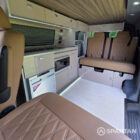 Rear lounge area with Liquor upholstery, Winter flooring and independent LED lighting creating a bright interior.